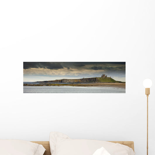 Dunstanburgh Castle On A Hill Under A Cloudy Sky Wall Mural