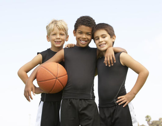 Young Boys In Basketball Team Wall Mural