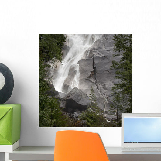 Water Cascading Down The Rock And Forming A Mist Wall Mural