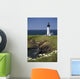 White Lighthouse On The Ocean With Blue Sky And Wildflowers Wall Mural