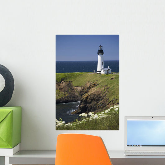 White Lighthouse On The Ocean With Blue Sky And Wildflowers Wall Mural