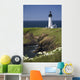 White Lighthouse On The Ocean With Blue Sky And Wildflowers Wall Mural