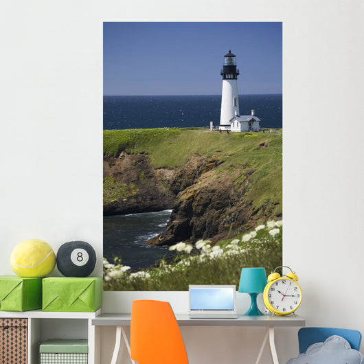 White Lighthouse On The Ocean With Blue Sky And Wildflowers Wall Mural