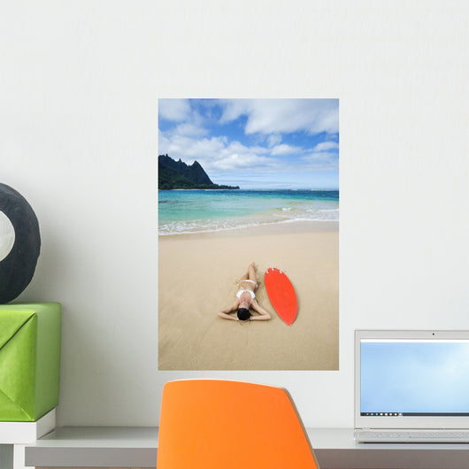 Woman Laying On Beach With Surfboard Wall Mural