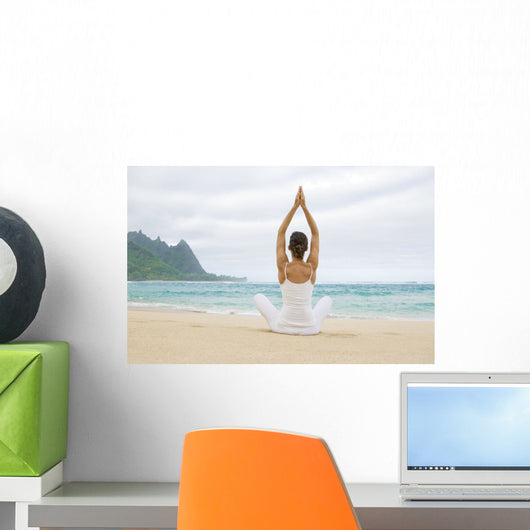 Woman Meditating On Sandy Shore Wall Mural