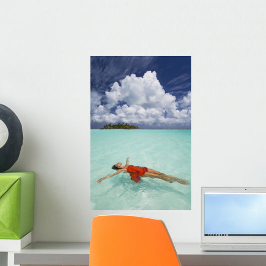 French Polynesia, Woman Floating In Ocean Water Wall Mural