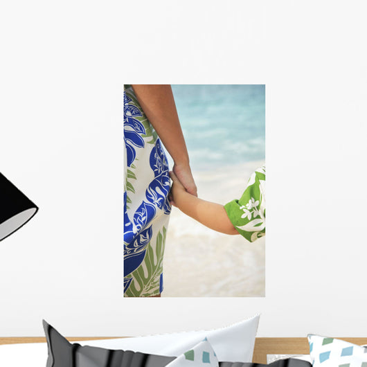 Closeup Of A Mother And Son Holding Hands Facing The Ocean Beach Wall Mural