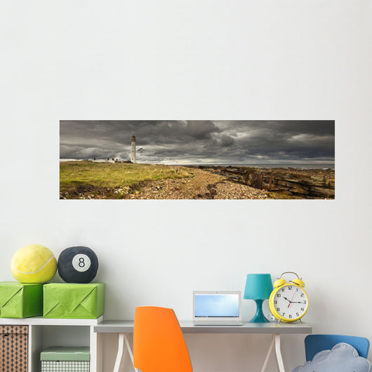 A Lighthouse And Piles Of Logs On The Shore Wall Mural