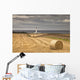 Barns Ness Lighthouse Along The Coast And Hay Bales In A Field Wall Mural