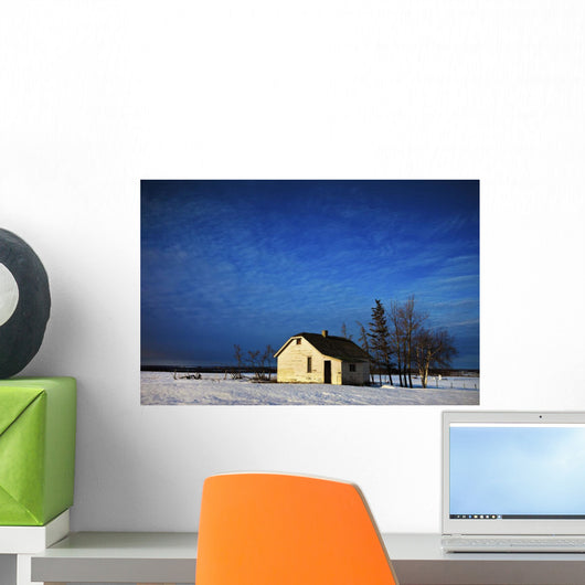 An Abandoned Homestead On A Snow Covered Field Wall Mural