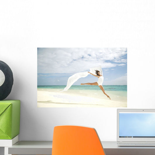 Beautiful Female Ballet Dancer Leaping Into Air Wall Mural
