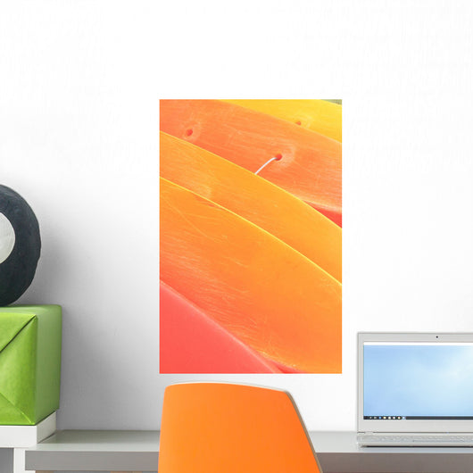 Pattern Shot Of Orange Yellow Kayaks Stacked On Each Other Wall Mural