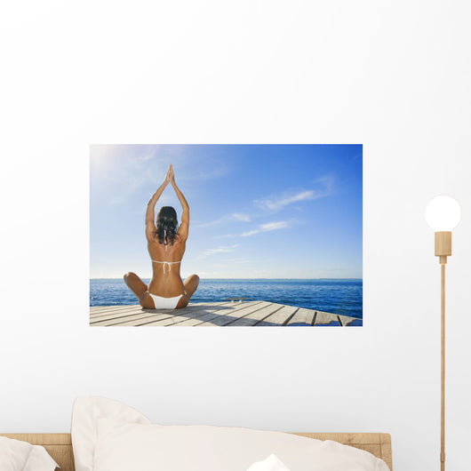 Hawaii, Woman Sitting On Dock In Remote Location Wall Mural