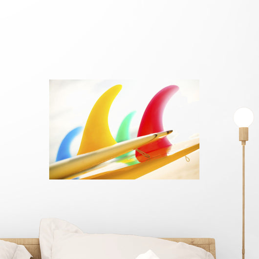 Colorful Surfboards Fins, Bright Sunny Sky In Background Wall Mural