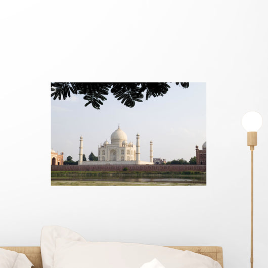 India, Temple burial site seen from Yamuna River at sunset Wall Mural