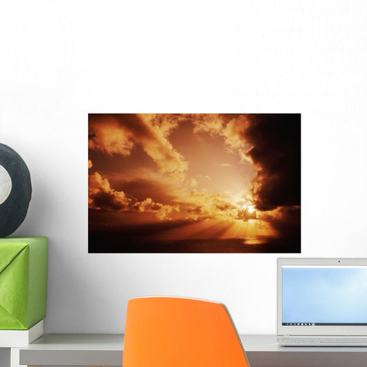 Orange Sunset Over Ocean, Sunrays Bursting Through Puffy Clouds Wall Mural
