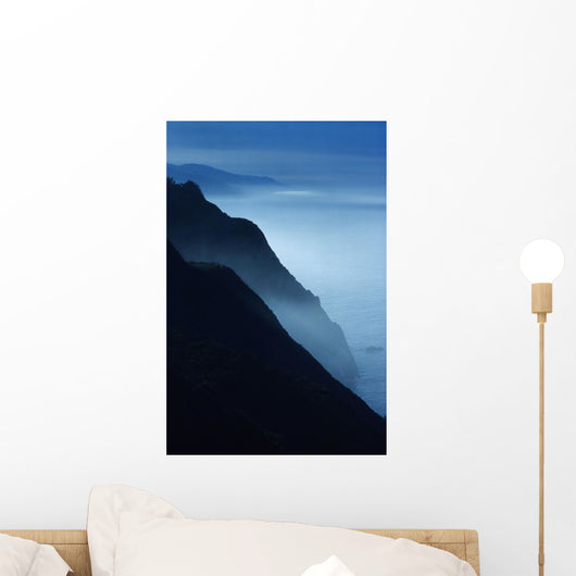Silhouetted Cliffs Along Foggy Ocean Shoreline Wall Mural