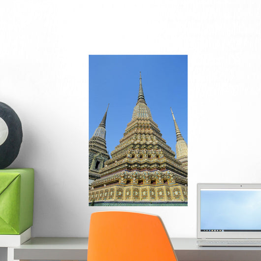 Thailand, Bangkok, Colorful Pointed Steeples Against Clear Blue Sky Wall Mural