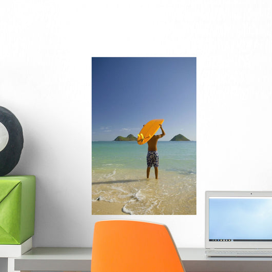 Surfer Walking Into The Water From The Beach With Board Over His Head Wall Mural