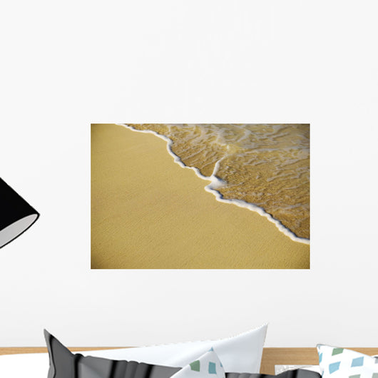 Close-Up Of Gentle Waves Washing Onto Sandy Tropical Beach Wall Mural
