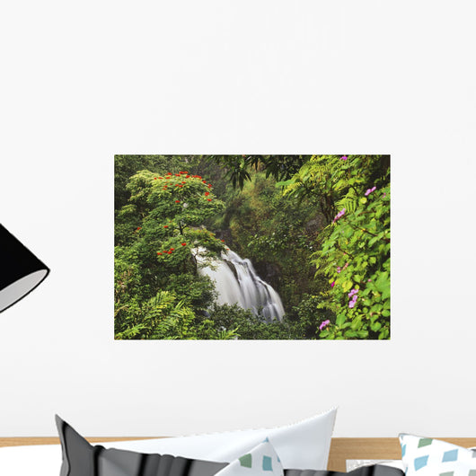 Waterfall Surrounded By Tropical Flowers And Plants Wall Mural