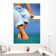 Hawaii, Legs And Feet Of Young Boy Sitting On A Bench By The Ocean Wall Mural