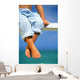 Hawaii, Legs And Feet Of Young Boy Sitting On A Bench By The Ocean Wall Mural