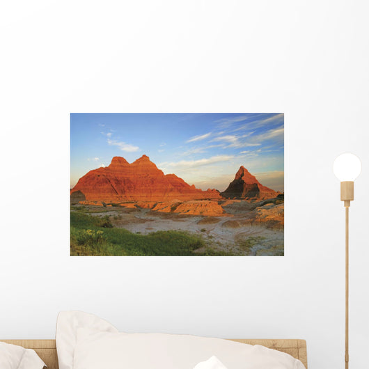A Red Sunrise Illuminates The Hills In Badlands National Park Wall Mural