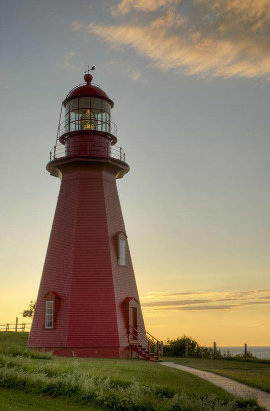 Red Lighthouse At Sunset Wall Mural