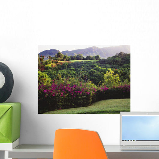 Flowers And Vegetation Line The Green Wall Mural