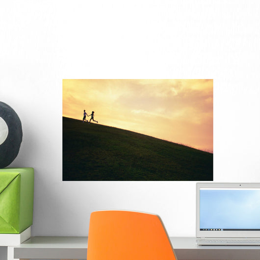 Hawaii, Couple Running Along A Hill At Sunset Wall Mural