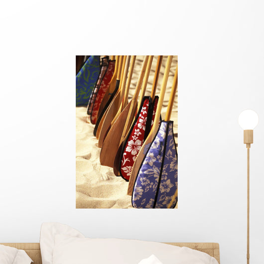 Hawaii, Paddles With Aloha Print Covers Lined Up Across Sand Wall Mural