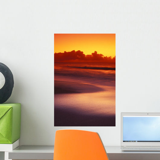 Beach At Sunset With Gentle Wave Rolling In Wall Mural