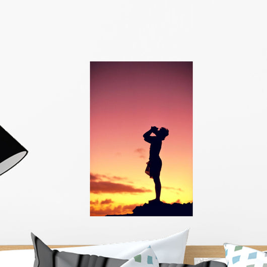 Man Silhouetted At Sunset, Conch Shell Blower Wall Mural