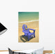 Blue Chair Along Shoreline With Plumeria Lei Hanging On Side Wall Mural