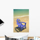 Blue Chair Along Shoreline With Plumeria Lei Hanging On Side Wall Mural