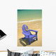 Blue Chair Along Shoreline With Plumeria Lei Hanging On Side Wall Mural