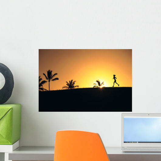 Woman In Distance, Silhouetted Running At Sunset, Palm Trees Wall Mural