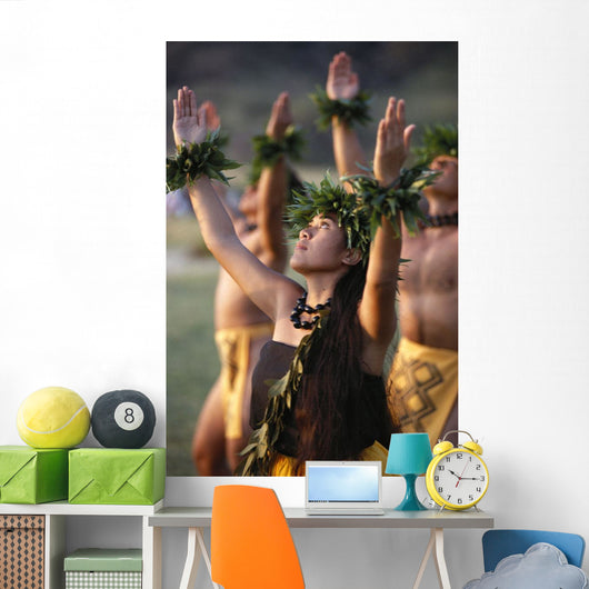 Side Angle Of Hula Dancers Kahiko All With Arms Raised, Looking Upward Wall Mural