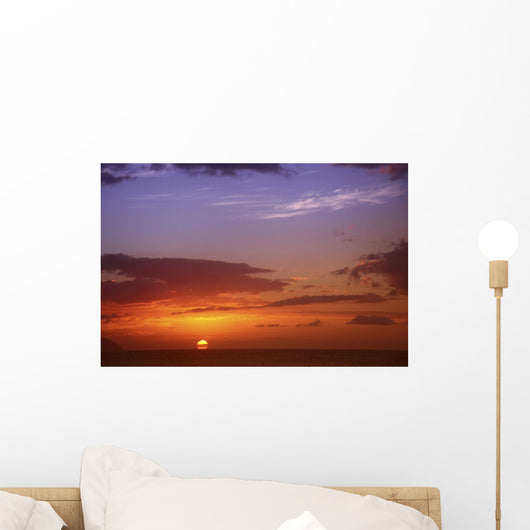 Sun Sinking Below The Horizon Wall Mural