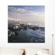 Fog And Rocky Shoreline In Winter With Cap Des Rosiers Lighthouse Wall Mural