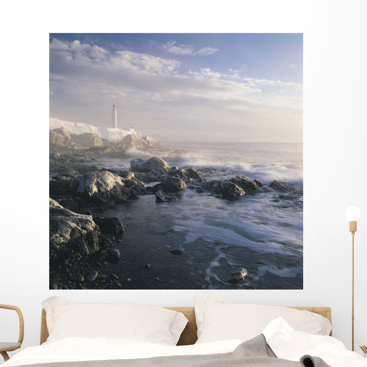 Fog And Rocky Shoreline In Winter With Cap Des Rosiers Lighthouse Wall Mural