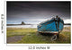A Weathered Boat Sitting On The Shore With Lindisfarne Castle Wall Mural