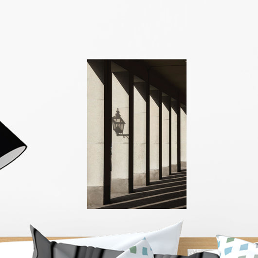 Shadows Cast By Sunlight Shining On Pillars And A Lantern Wall Mural