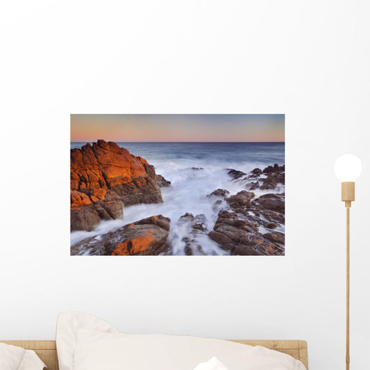California, Malibu, Sunset over rocky ocean coastline Wall Mural