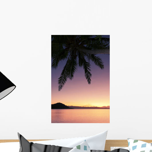 Fiji, Matangi Private Island Resort, Sunset glow over ocean Wall Mural