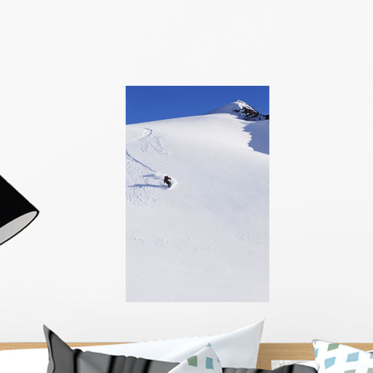 Backcountry Snowboarder Carving Turns Down A Steep Mountain Face Wall Mural