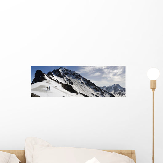 A Backcountry Snowboarder And Skier Hike Wall Mural