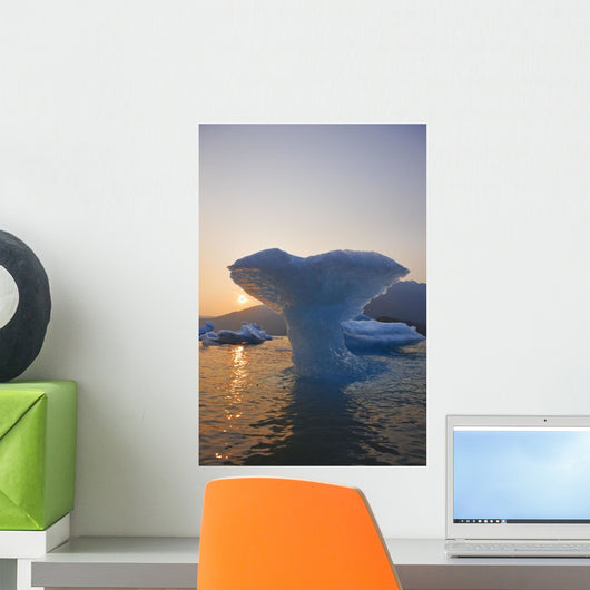 Sunset Beyond Ice Sculpture Of A Whales Tail Wall Mural