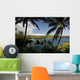Hawaii, Maui, A sunny view of Waianapanapa from behind palm trees Wall Mural